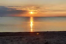 Sunset on a beach. Photo. 