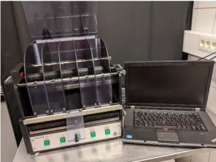 Photo of a lap top and Rotarod test instrument.